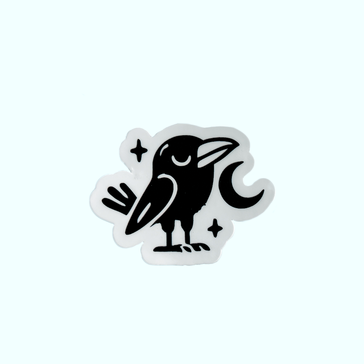 Black and white vinyl sticker of Raven with the moon, inspired by the Tlingit story of how Raven brought light to the world. Weatherproof vinyl